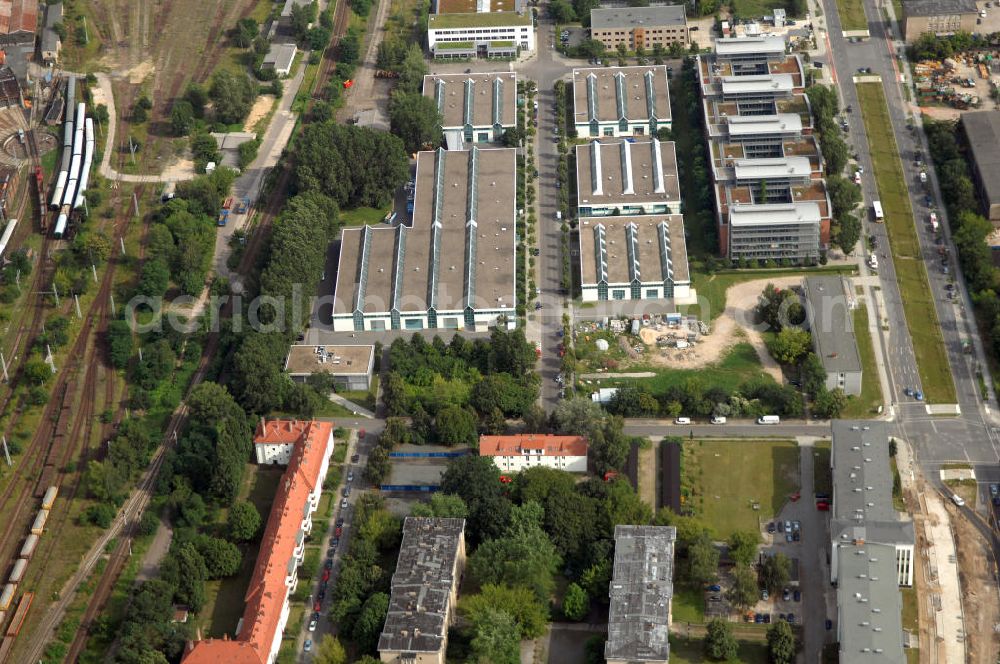 Aerial photograph Berlin - Blick auf das Wohn- und Industriegebiet an der Bahntrasse Niederschöneweide im Bereich der Landfliegerstrasse, Pilotenstraße, Hagedornstraße und Groß-Berliner Damm. Eine Immobilie der HVB Immobilien AG