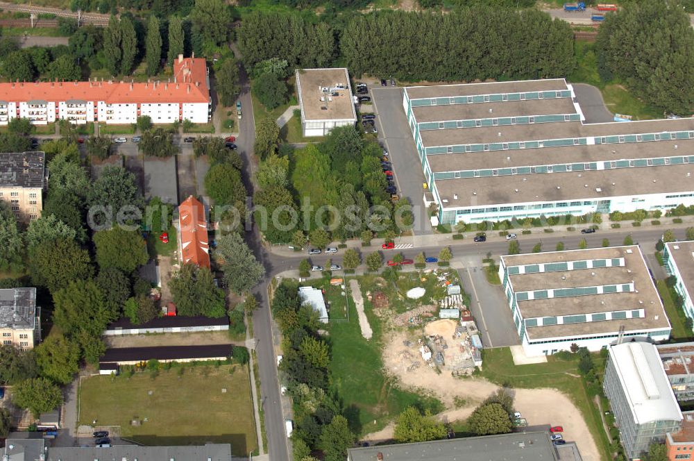 Aerial photograph Berlin - Blick auf das Wohn- und Industriegebiet an der Bahntrasse Niederschöneweide im Bereich der Landfliegerstrasse, Pilotenstraße, Hagedornstraße und Groß-Berliner Damm. Eine Immobilie der HVB Immobilien AG