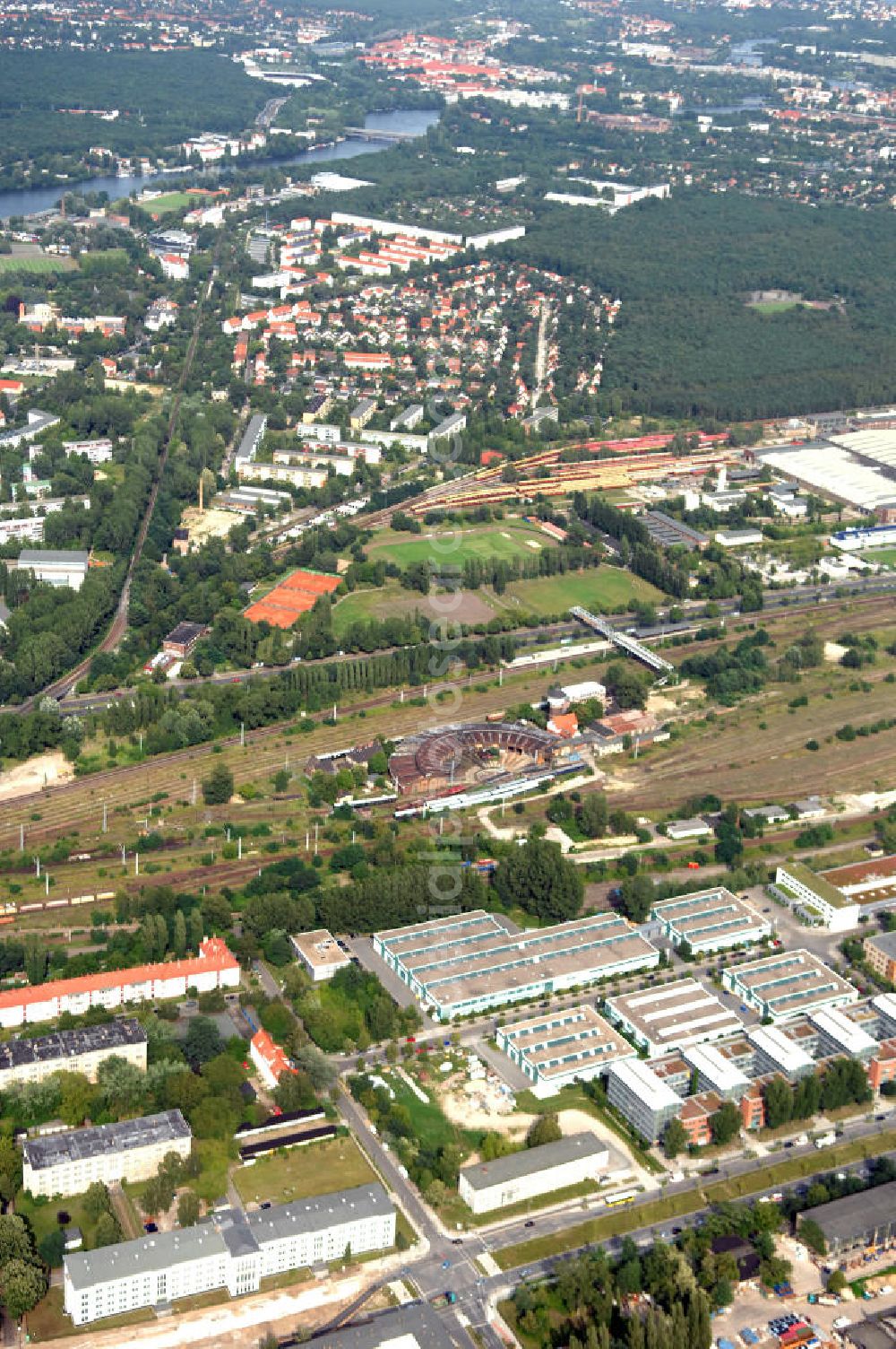 Aerial photograph Berlin - Blick auf das Wohn- und Industriegebiet an der Bahntrasse Niederschöneweide im Bereich der Landfliegerstrasse, Pilotenstraße, Hagedornstraße und Groß-Berliner Damm. Eine Immobilie der HVB Immobilien AG