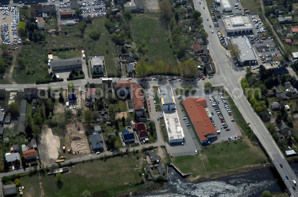 Aerial image Berlin - Blick auf das Gewerbegebiet Flugplatz Johannisthal / WISTA (links des Teltowkanals am Ernst-Ruska-Ufer) und dem Industrie und Wohngebieten rechts des Teltowkanals nördöstlich des Verlaufes der Stadtautobahn A 113.