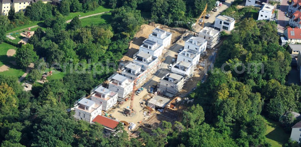 Aerial photograph Bad Vilbel - Blick auf die Baustelle der Wohnanlage am Tannenweg der cds Wohnbau GmbH. In Waldrandlage entstehen hier mehrere Wohnneubauten durch die cds Wohnbau GmbH, einem Frankfurter Immobiliendienstleister. View the construction site of the residental complex on Tannenweg. At the forest are several new residential buildings built by the CDS Wohnbau GmbH, a Frankfurt real estate service provider.