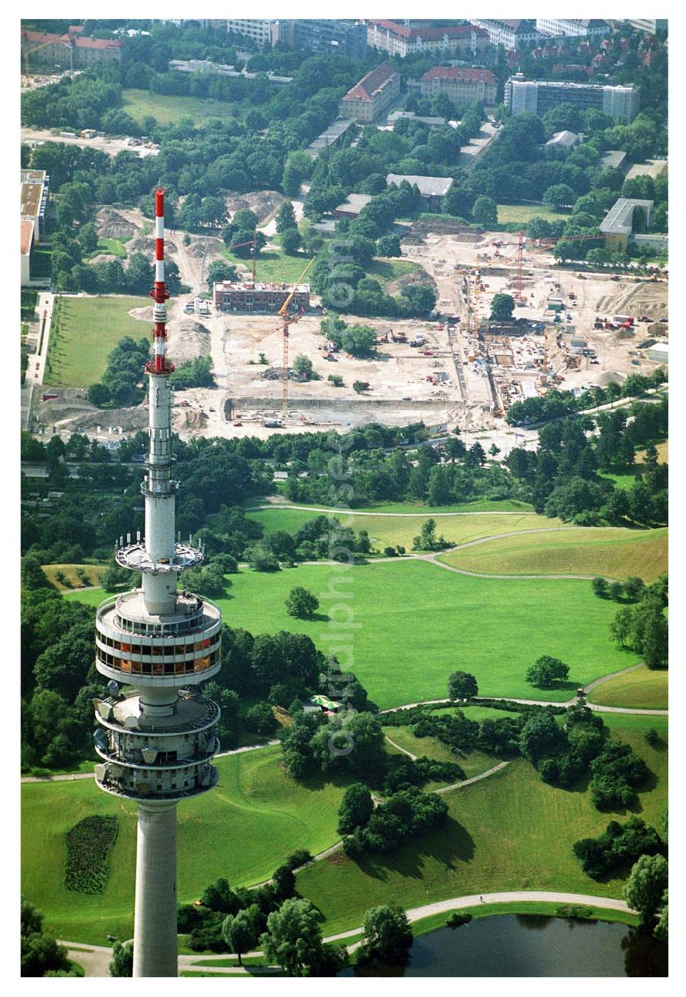 München / Bayern from the bird's eye view: 13.07.2005 München Blick auf den Münchener Fernsehturm und dem Bau der Wohnanlagen in der Ackermannstraße (Ackermannbogen) in München Schwabingen nahe dem Olympia Park. Firma Concept Bau GmbH (CONCEPTBAUGOLD)