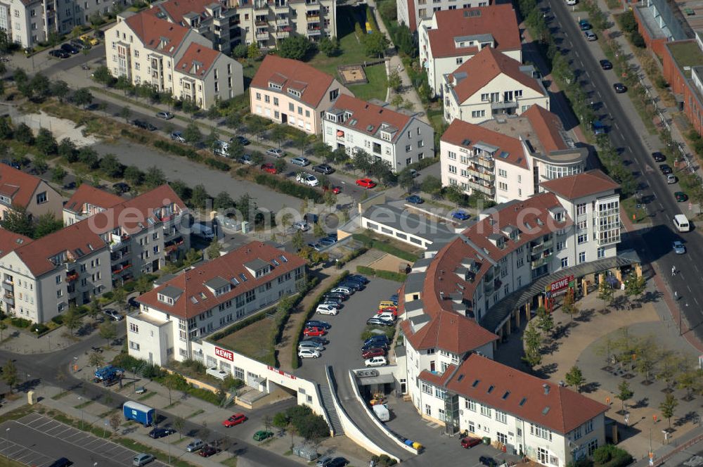 Aerial photograph Berlin - Blick auf Mehrfamilienhäuser bzw. Wohn- und Geschäftshaus an der Karower Chaussee Ecke Achillesstraße Ecke Am Elsebrocken Ecke Matestraße Ecke Teichbergstraße in Karow.