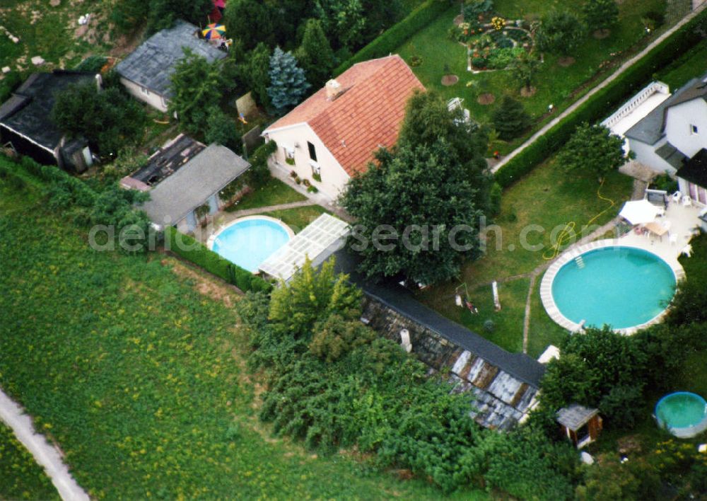 Aerial photograph Berlin-Mahlsdorf - Blick auf das Wohngebiet an der Lortzingstraße in Berlin-Mahlsdorf. View of the residential area at the street Lortzingstrasse in the district Mahlsdorf.