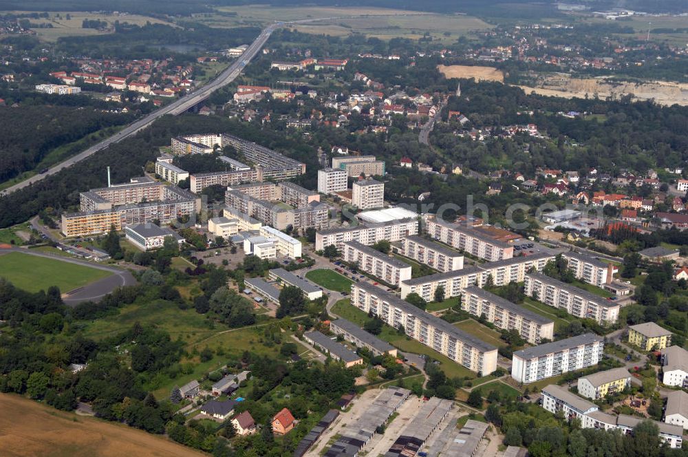 Aerial photograph Rüdersdorf - Blick auf das Wohngebiet Brückenstraße / Friedrich-Engels-Ring in Rüdersdorf. Die Siedlung entstand in den 70er Jahren im Zusammenhang mit der Erweiterung des nahegelegenen Kalksteintagebaus. Eigentümer ist die Wohnungsbaugesellschaft Rüdersdorf mbH. Kontakt: Tel. +49(0)33638 7570, Email: info@wbg-ruedersdorf.de