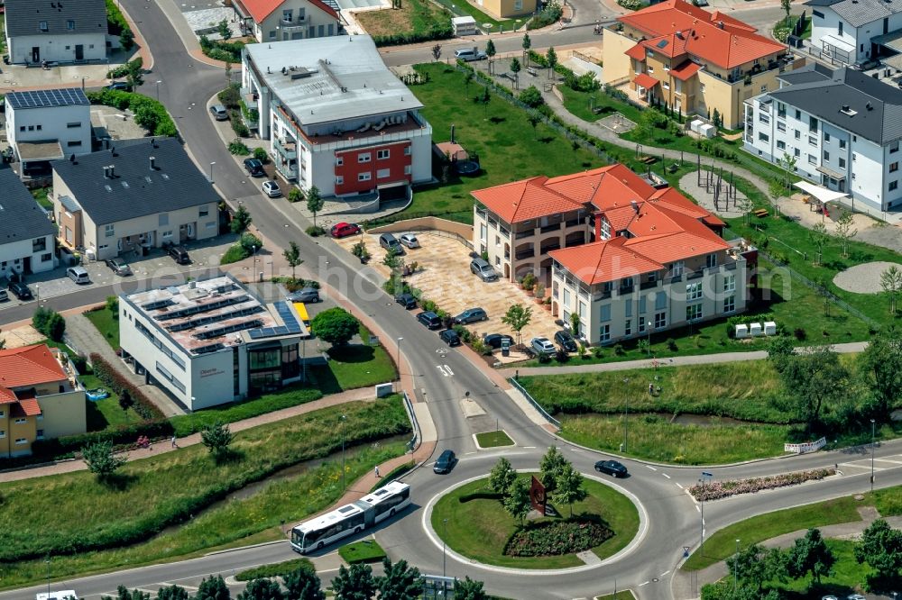 Ettenheim from the bird's eye view: Construction sites for new construction residential area of detached housing estate and Mehrfamilienhaeuser Im Fuerstenfeld in Ettenheim in the state Baden-Wurttemberg, Germany