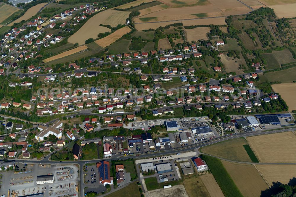 Röttingen from the bird's eye view: Single-family residential area of settlement on the edge of agricultural fields in Röttingen in the state Bavaria, Germany