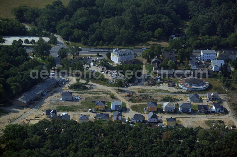 Aerial photograph Hoppegarten - Single-family residential area of settlement in the Dahlwitz part of Hoppegarten in the state of Brandenburg. A historic building is being renovated and new single family houses are being built on site of the historic area of the race track of Hoppegarten