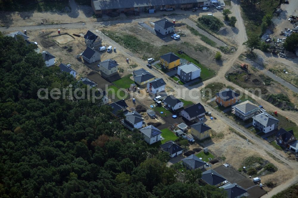 Hoppegarten from above - Single-family residential area of settlement in the Dahlwitz part of Hoppegarten in the state of Brandenburg. A historic building is being renovated and new single family houses are being built on site of the historic area of the race track of Hoppegarten