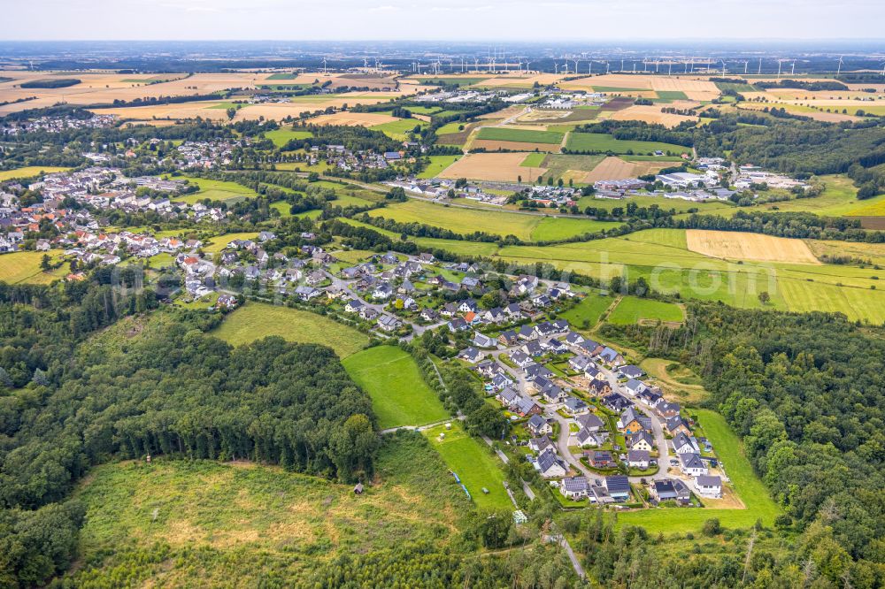 Warstein from above - Single-family residential area of settlement along the street Rabenknapp in a wooded area in Warstein in the state North Rhine-Westphalia, Germany