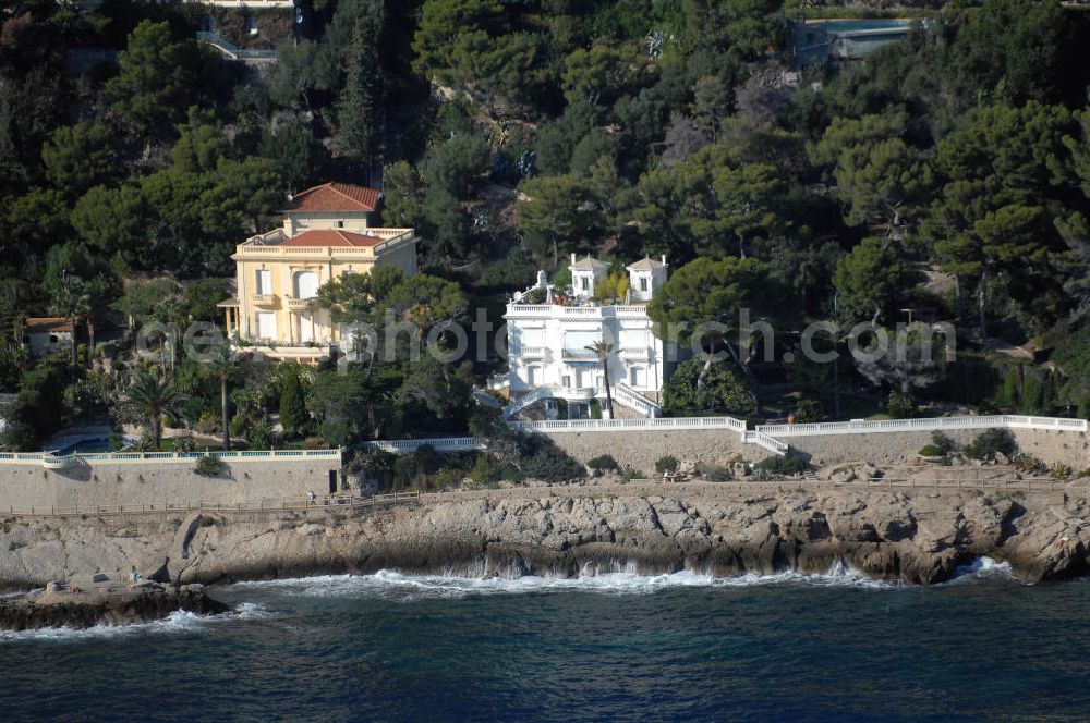 Aerial photograph MONACO - Blick auf ein Wohngebiet entlang der Avenue Raymond Gramaglia in Cap-d' Ail. Cap-d' Ail ist ein kleiner französischer Badeort an der Cote d' Azur und Grenzort zum Fürstentum Monaco. Die deutsche Übersetzung des Namens lautet „Knoblauchkap“. Der Ort liegt am Fuße des steil aufragenden Bergs Tete de Chien bei La Turbie.