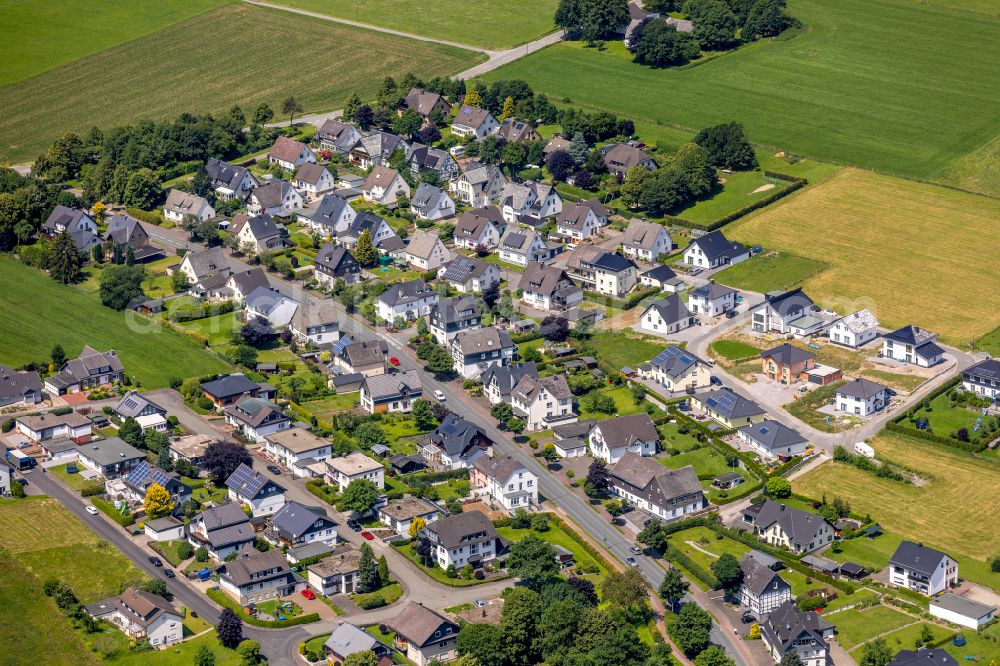 Altenbüren from above - Residential areas on the edge of agricultural land in Altenbüren at Sauerland in the state North Rhine-Westphalia, Germany