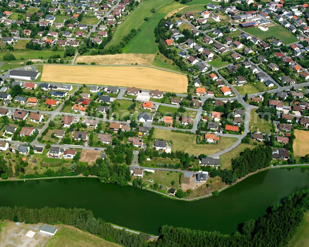 Tauperlitz from above - Residential areas on the edge of agricultural land in Tauperlitz in the state Bavaria, Germany