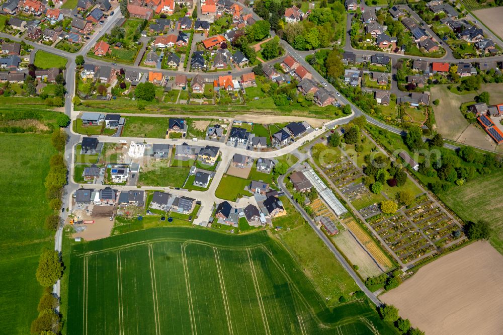 Walstedde from the bird's eye view: Residential areas on the edge of agricultural land in Walstedde in the state North Rhine-Westphalia, Germany