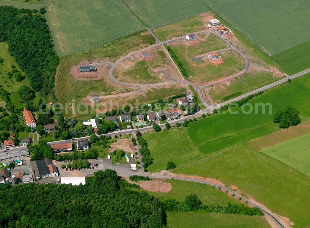 Winnweiler from above - Residential areas on the edge of agricultural land in Winnweiler in the state Rhineland-Palatinate, Germany