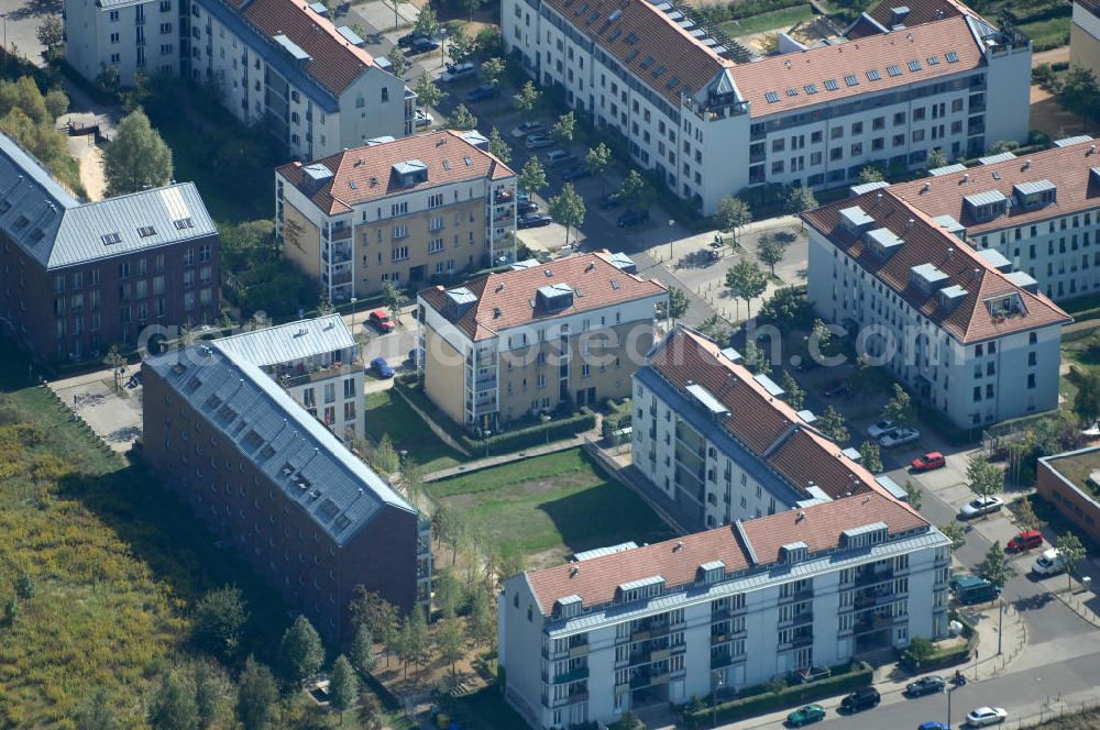 Aerial photograph Berlin - Blick auf Mehrfamilienhäuser an der Pfannschmidtstraße Ecke Ballonplatz im Wohngebiet / Neubaugebiet Karow-Nord.