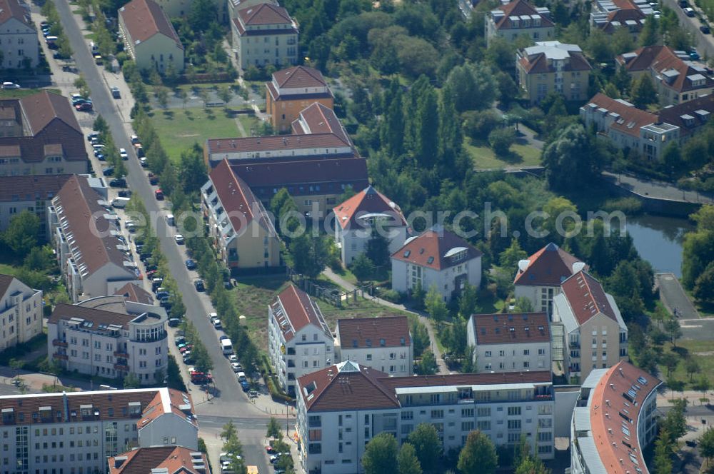 Aerial photograph Berlin - Blick auf Mehrfamilienhäuser an der Busonistraße Ecke Achillesstraße im Wohngebiet / Neubaugebiet Karow-Nord.