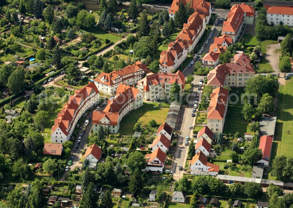 Aerial photograph Gotha - The residential development in a residential area Kindermann road - Maybachstrasse in Gotha in Thuringia belongs to the cooperative settlement of the Gotha Cooperative for officials and workers of the railway administration. The multi-family houses were built according to the designs of architect Richard Neuland and Bruno Tamme. The aim of the project was to create affordable and attractive living space despite the prevailing time of construction of housing