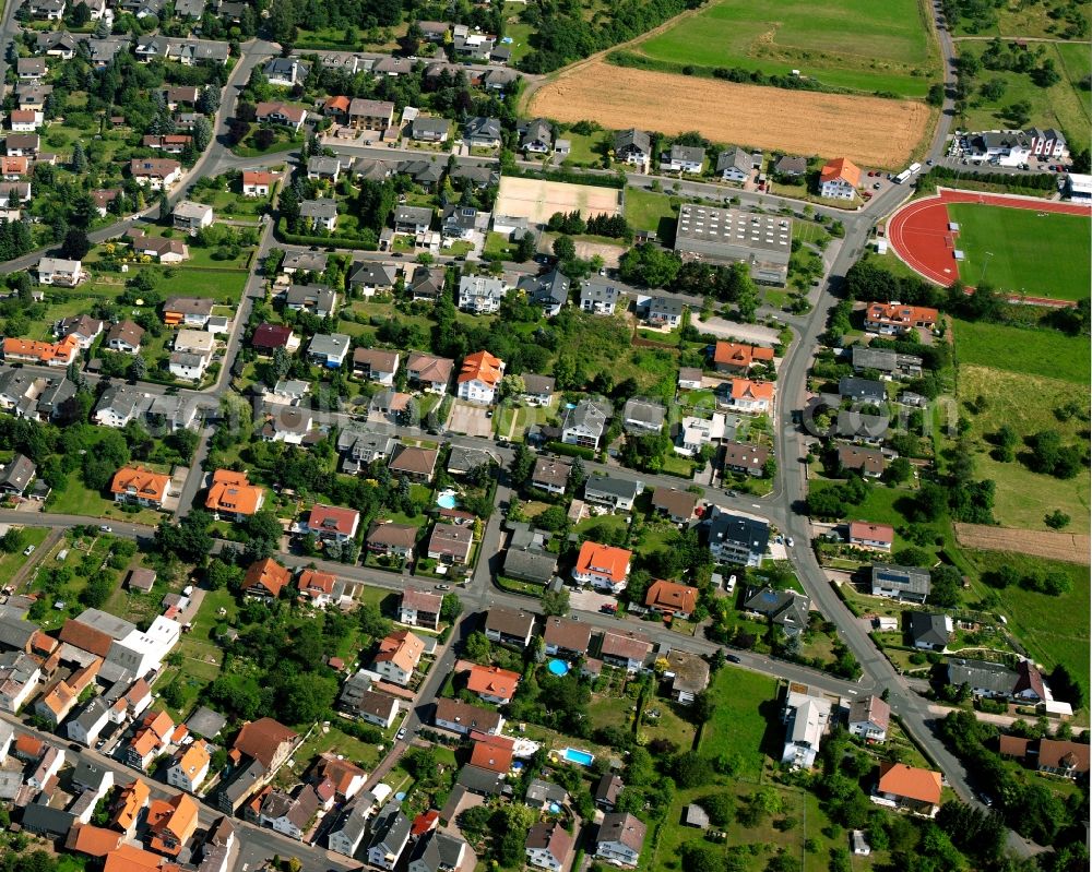 Alten-Buseck from the bird's eye view: Residential area of the multi-family house settlement in Alten-Buseck in the state Hesse, Germany