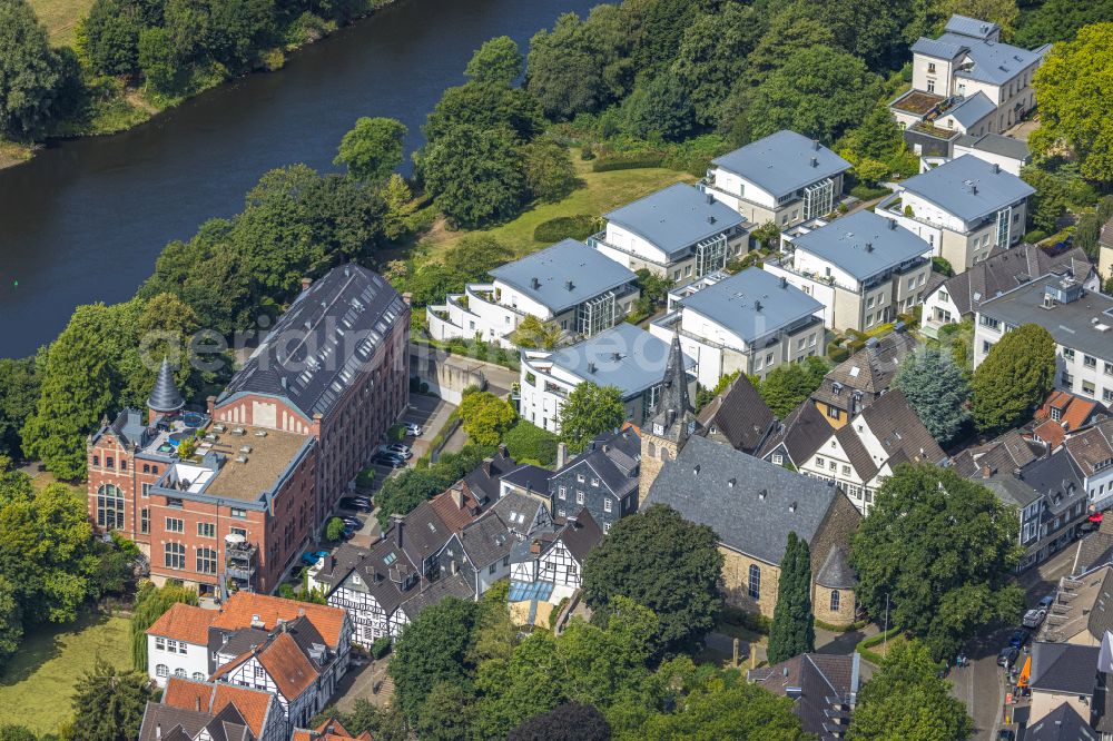 Kettwig from the bird's eye view: Residential area of the multi-family house settlement with terraced houses and a church building in Kettwig at Ruhrgebiet in the state North Rhine-Westphalia, Germany