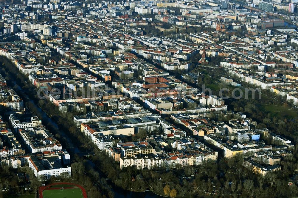 Berlin from above - Residential area of a multi-family house settlement on the bank and river of Landwehrkanal in the district Kreuzberg in Berlin, Germany