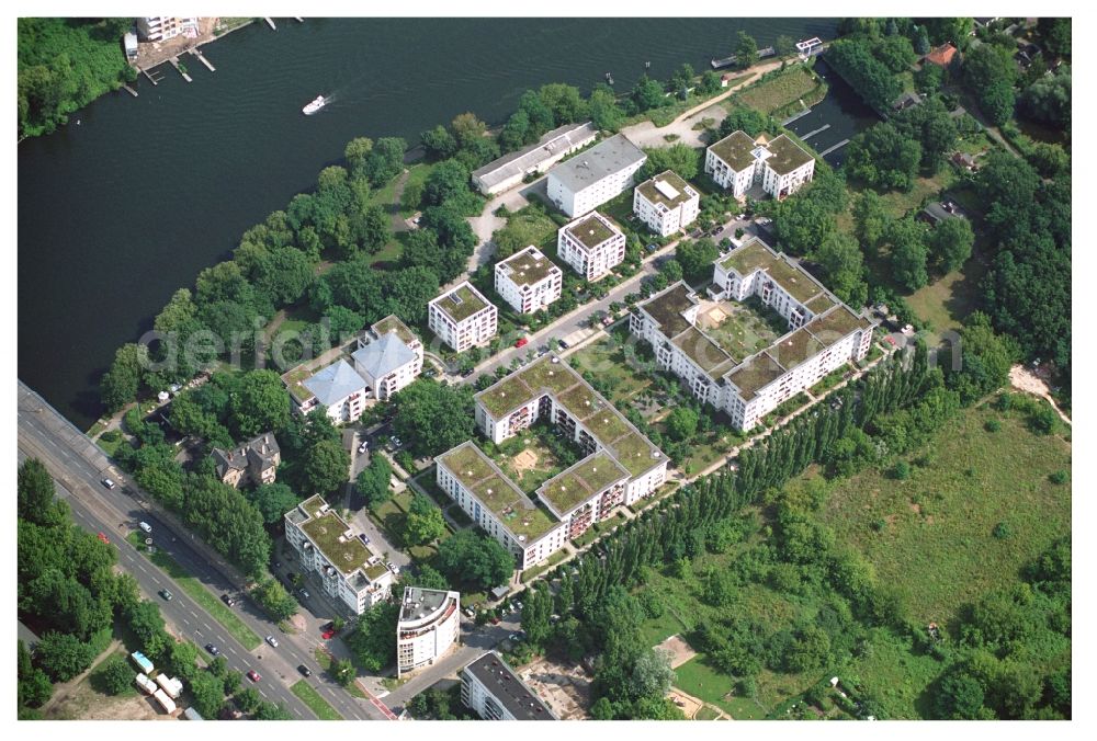 Berlin from above - Residential area of a multi-family house settlement on the bank and river of Mueggelspree on street Salvador-Allende-Strasse in the district Koepenick in Berlin, Germany