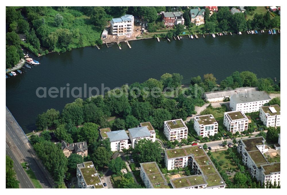 Berlin from above - Residential area of a multi-family house settlement on the bank and river of Mueggelspree on street Salvador-Allende-Strasse in the district Koepenick in Berlin, Germany