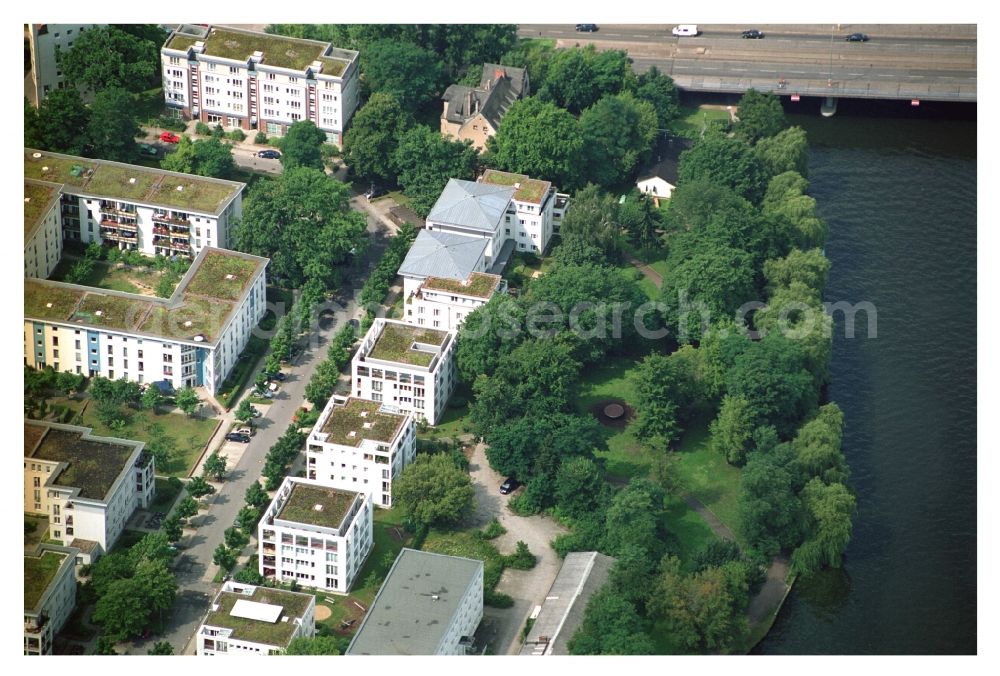 Berlin from above - Residential area of a multi-family house settlement on the bank and river of Mueggelspree on street Salvador-Allende-Strasse in the district Koepenick in Berlin, Germany