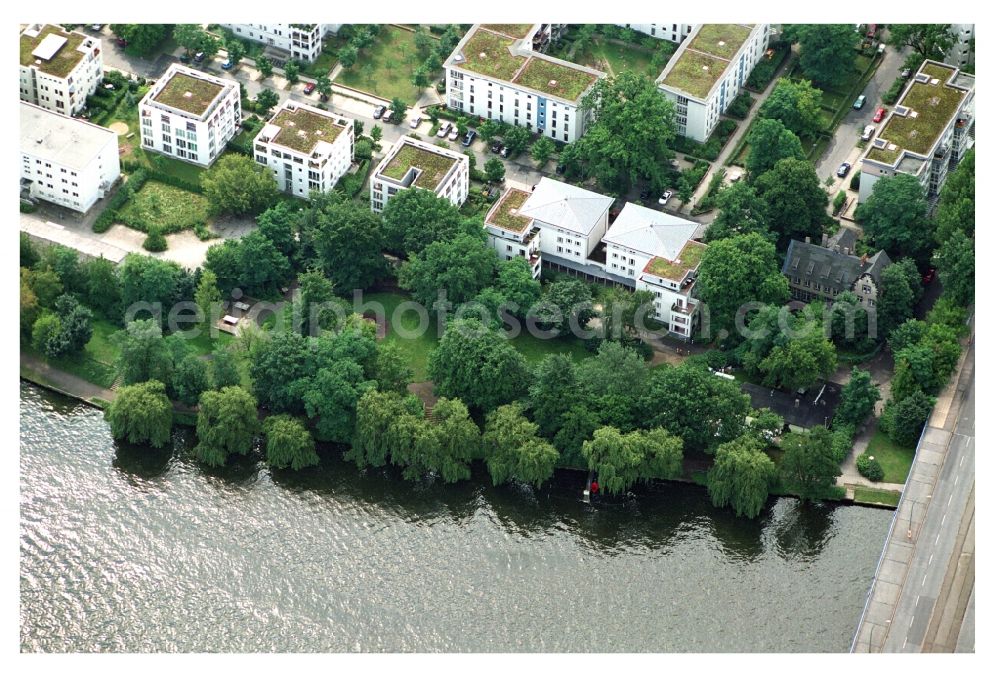 Aerial image Berlin - Residential area of a multi-family house settlement on the bank and river of Mueggelspree on street Salvador-Allende-Strasse in the district Koepenick in Berlin, Germany