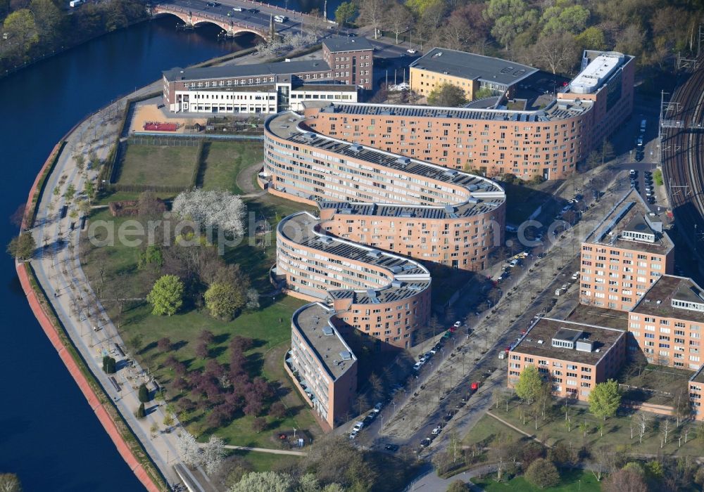 Berlin from above - Residential area of a multi-family house settlement on the bank and river of Spree River in the district Moabit in Berlin, Germany