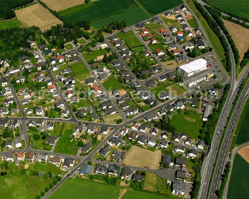 Ahlbach from above - Residential area - mixed development of a multi-family housing estate and single-family housing estate in Ahlbach in the state Hesse, Germany