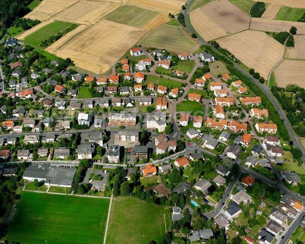 Annerod from the bird's eye view: Residential area - mixed development of a multi-family housing estate and single-family housing estate in Annerod in the state Hesse, Germany