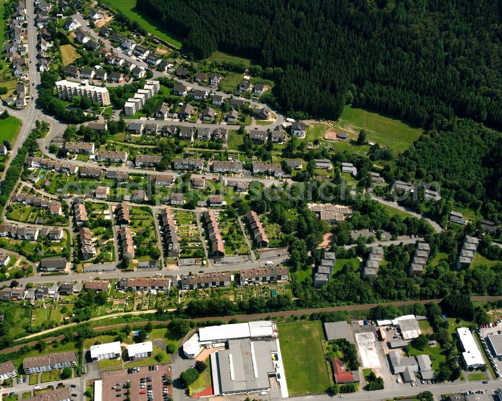 Bad Berleburg from the bird's eye view: Residential area - mixed development of a multi-family housing estate and single-family housing estate in Bad Berleburg at Siegerland in the state North Rhine-Westphalia, Germany