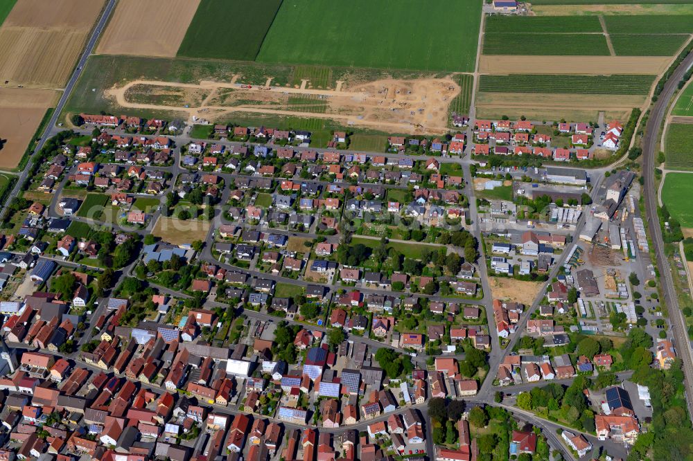 Bergtheim from the bird's eye view: Residential area - mixed development of a multi-family housing estate and single-family housing estate in Bergtheim in the state Bavaria, Germany