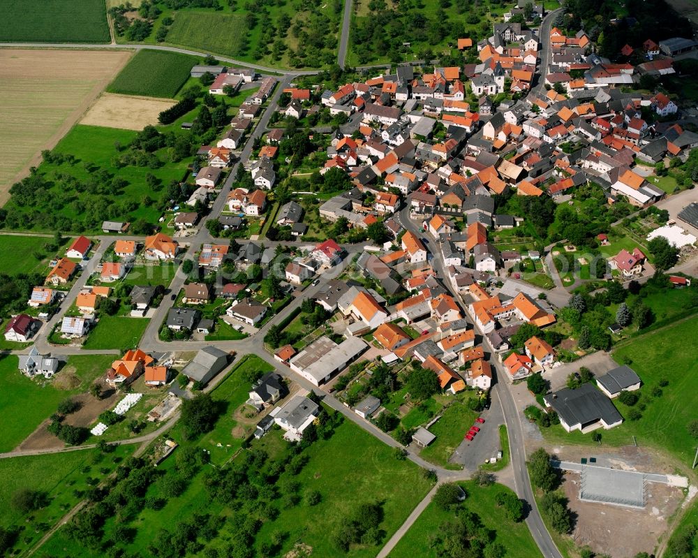 Bettenhausen from the bird's eye view: Residential area - mixed development of a multi-family housing estate and single-family housing estate in Bettenhausen in the state Hesse, Germany