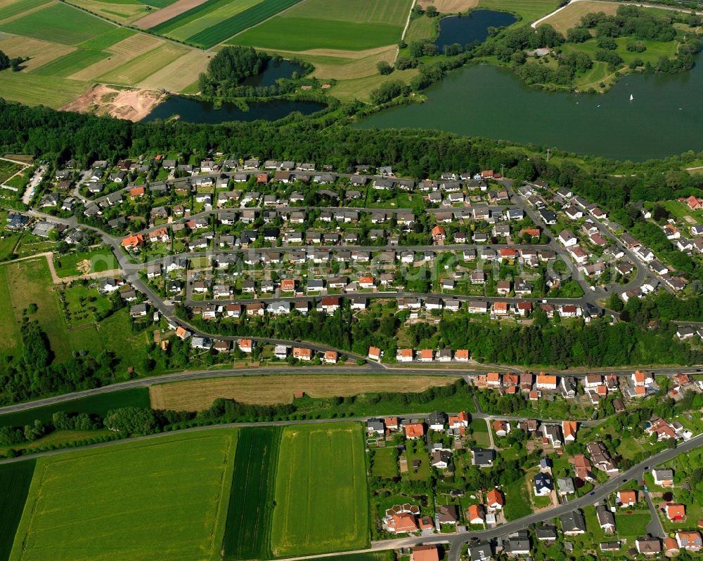 Aerial photograph Breitenbach - Residential area - mixed development of a multi-family housing estate and single-family housing estate in Breitenbach in the state Hesse, Germany