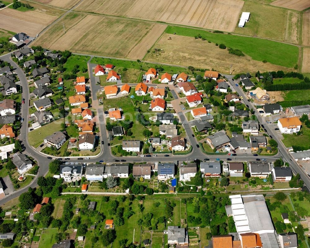 Burkhardsfelden from the bird's eye view: Residential area - mixed development of a multi-family housing estate and single-family housing estate in Burkhardsfelden in the state Hesse, Germany