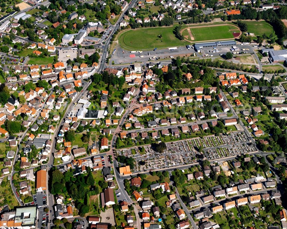 Dorf-Erbach from the bird's eye view: Residential area - mixed development of a multi-family housing estate and single-family housing estate in Dorf-Erbach in the state Hesse, Germany