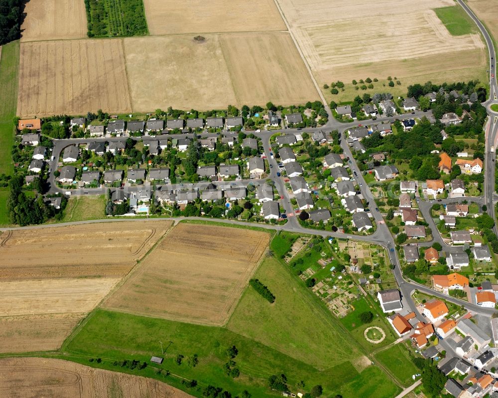 Dorf-Güll from the bird's eye view: Residential area - mixed development of a multi-family housing estate and single-family housing estate in Dorf-Güll in the state Hesse, Germany