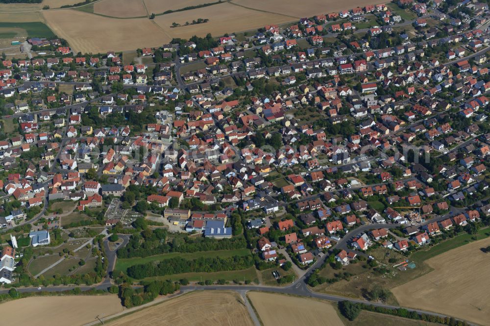 Eisingen from above - Residential area - mixed development of a multi-family housing estate and single-family housing estate in Eisingen in the state Bavaria, Germany