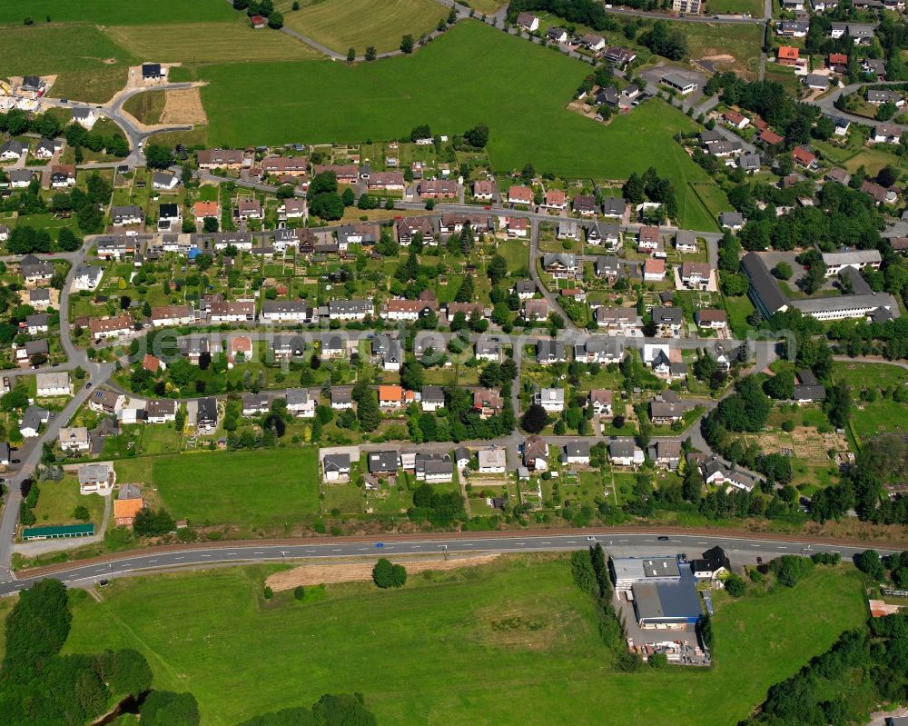 Erndtebrück from the bird's eye view: Residential area - mixed development of a multi-family housing estate and single-family housing estate in Erndtebrück at Siegerland in the state North Rhine-Westphalia, Germany