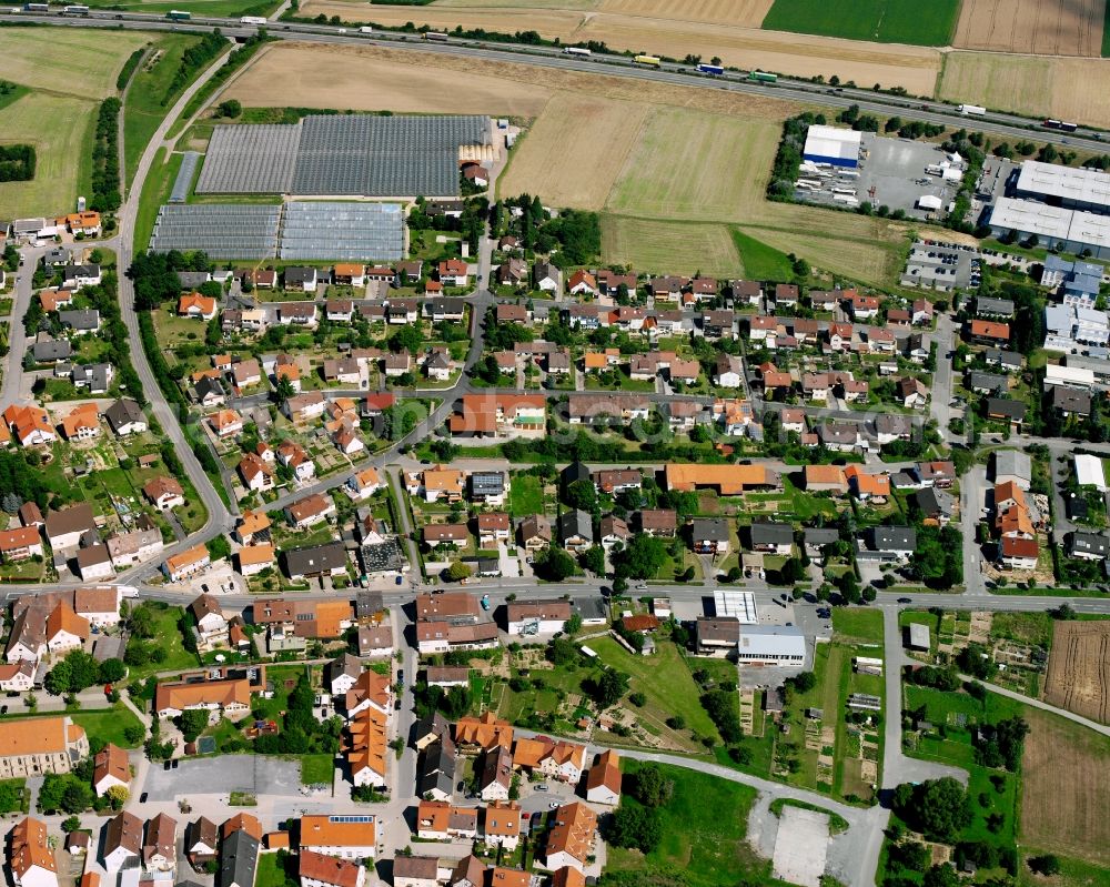 Fürfeld from the bird's eye view: Residential area - mixed development of a multi-family housing estate and single-family housing estate in Fürfeld in the state Baden-Wuerttemberg, Germany