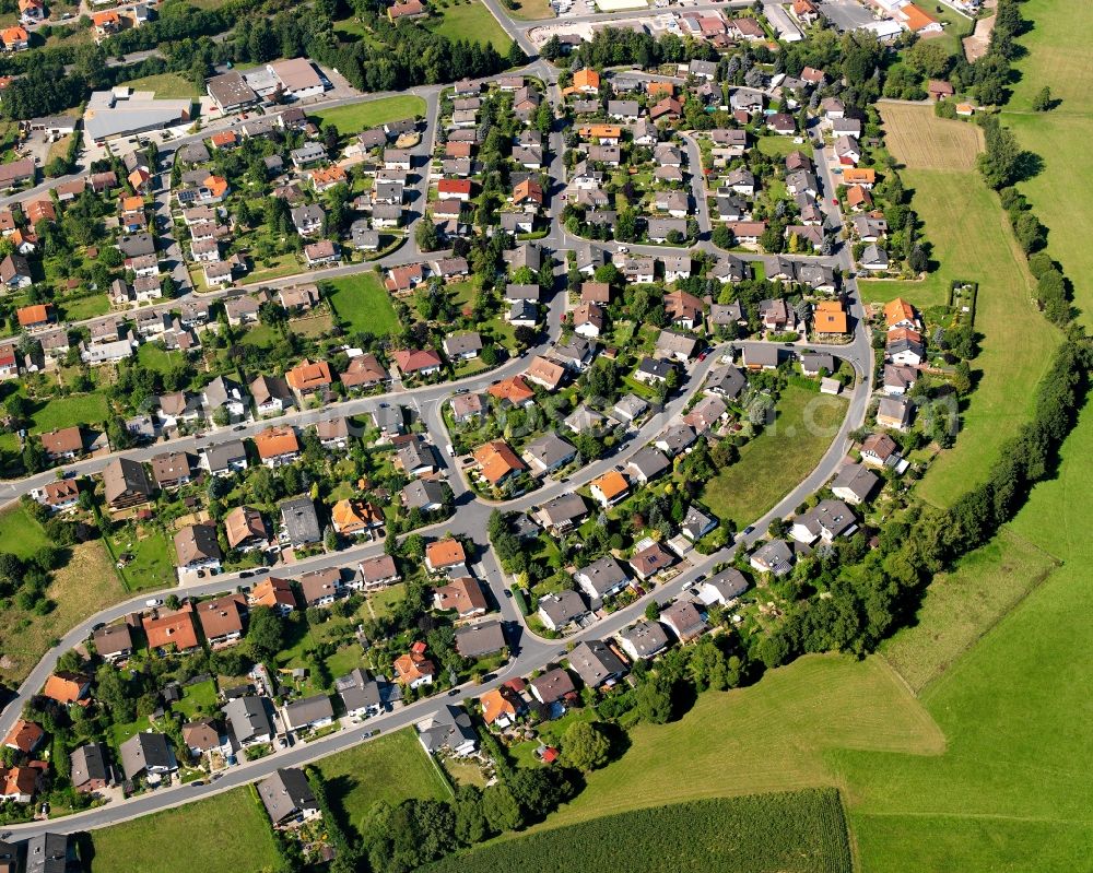 Fränkisch-Crumbach from the bird's eye view: Residential area - mixed development of a multi-family housing estate and single-family housing estate in Fränkisch-Crumbach in the state Hesse, Germany