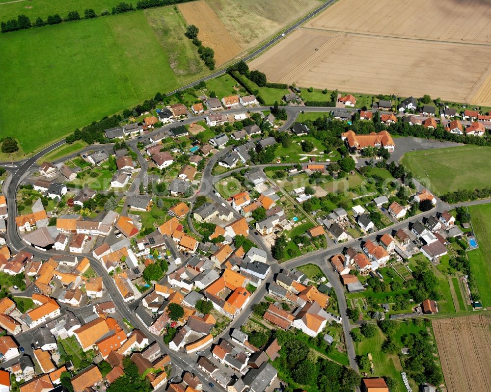 Hattenrod from above - Residential area - mixed development of a multi-family housing estate and single-family housing estate in Hattenrod in the state Hesse, Germany