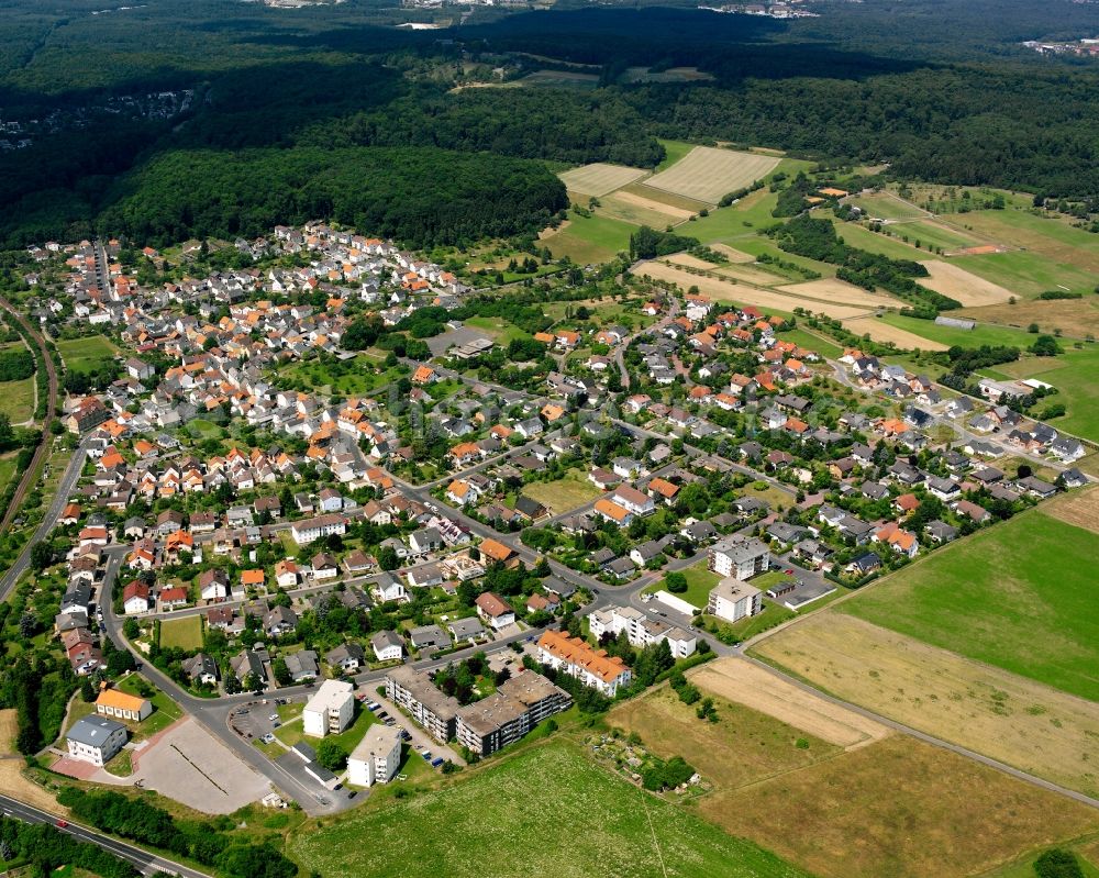 Hausen from above - Residential area - mixed development of a multi-family housing estate and single-family housing estate in Hausen in the state Hesse, Germany