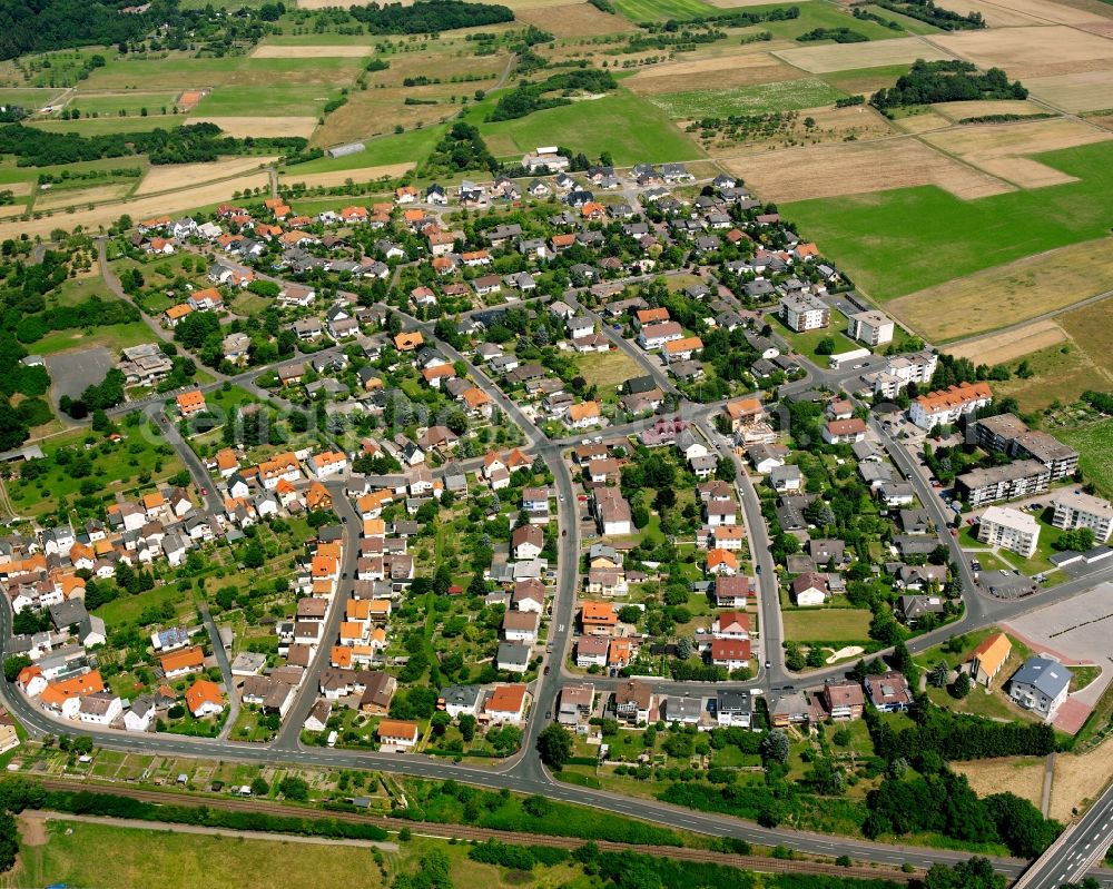 Hausen from the bird's eye view: Residential area - mixed development of a multi-family housing estate and single-family housing estate in Hausen in the state Hesse, Germany