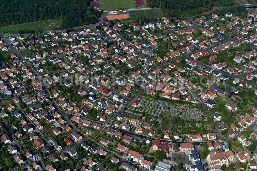 Höchberg from the bird's eye view: Residential area - mixed development of a multi-family housing estate and single-family housing estate in Höchberg in the state Bavaria, Germany