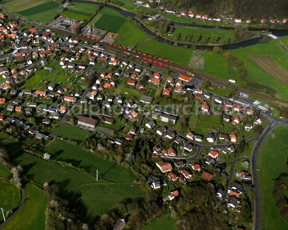 Heimboldshausen from above - Residential area - mixed development of a multi-family housing estate and single-family housing estate in Heimboldshausen in the state Hesse, Germany