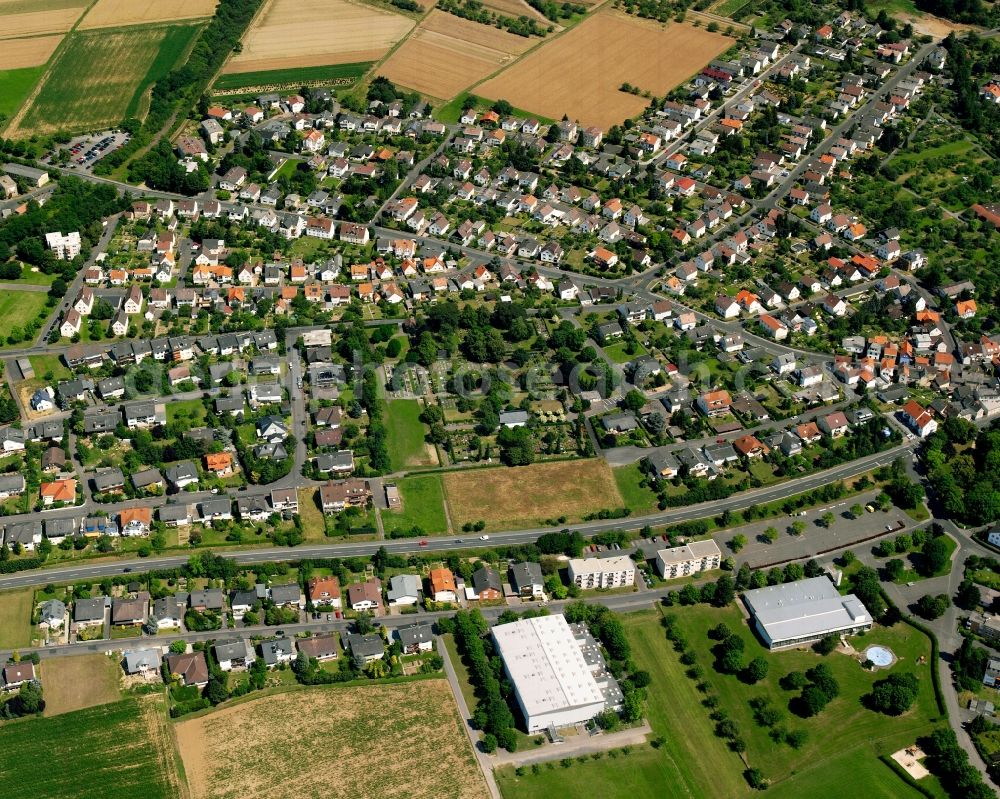 Heuchelheim from above - Residential area - mixed development of a multi-family housing estate and single-family housing estate in Heuchelheim in the state Hesse, Germany