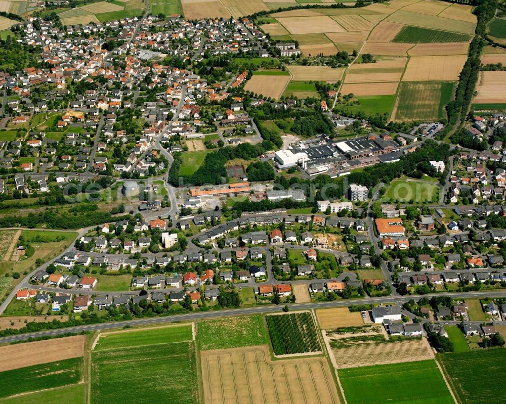 Heuchelheim from the bird's eye view: Residential area - mixed development of a multi-family housing estate and single-family housing estate in Heuchelheim in the state Hesse, Germany